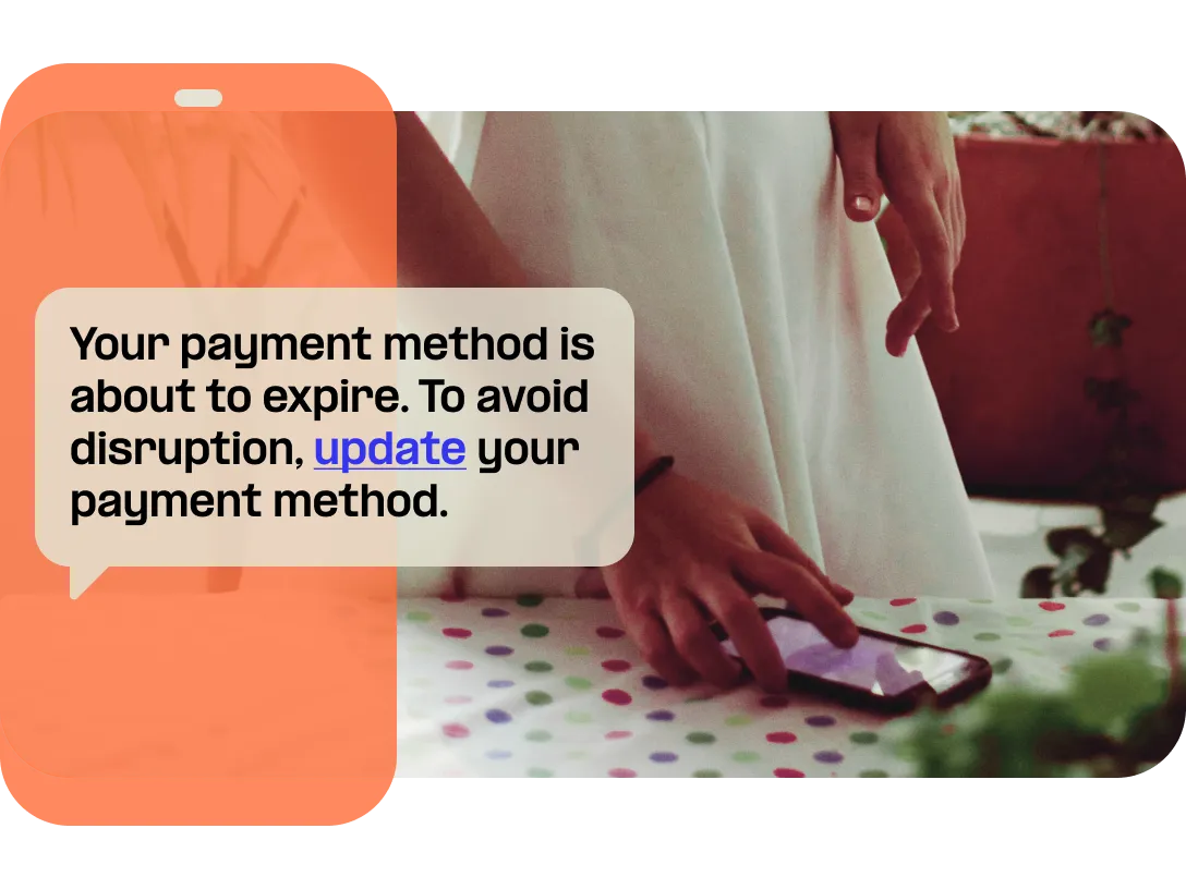 Person receiving account notification via text message