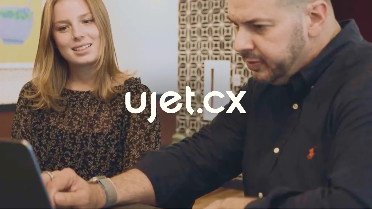 UJET CTO Dave Bullock and coworker behind the UJET logo